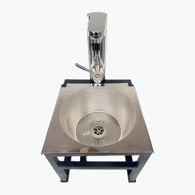 Custom fabricated stainless hand-wash sink on stand — hose-fed, electric instant hot tap